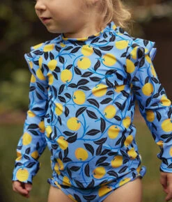 The Girls' Ruffle Rash Guard Tankini Set - Nectarine Orchard -Cheap Sunset Bikini Store 5 ExtraProductShot 1efe85e3 2325 4479 99f8 a7210feaf0fd